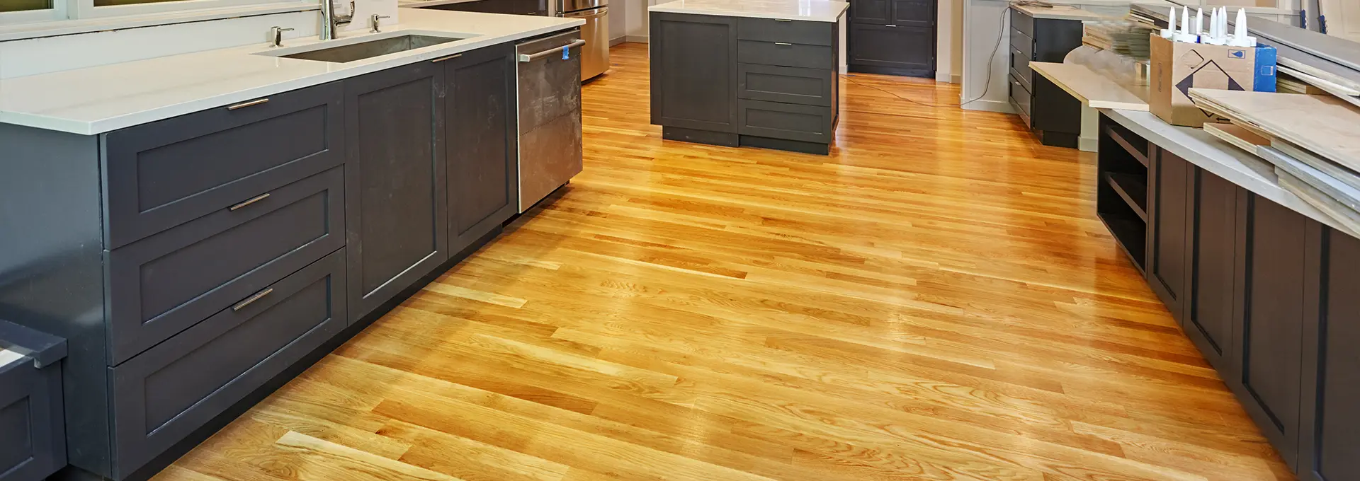 Hardwood floor refinished by Elite Tile & Floors